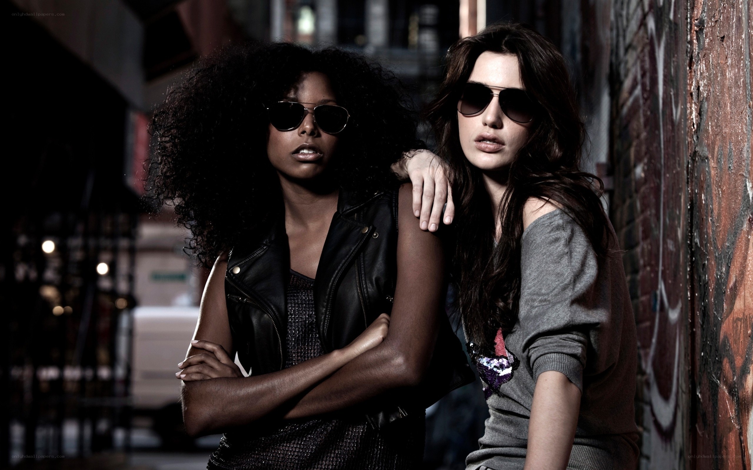 two women in sunglasses on street