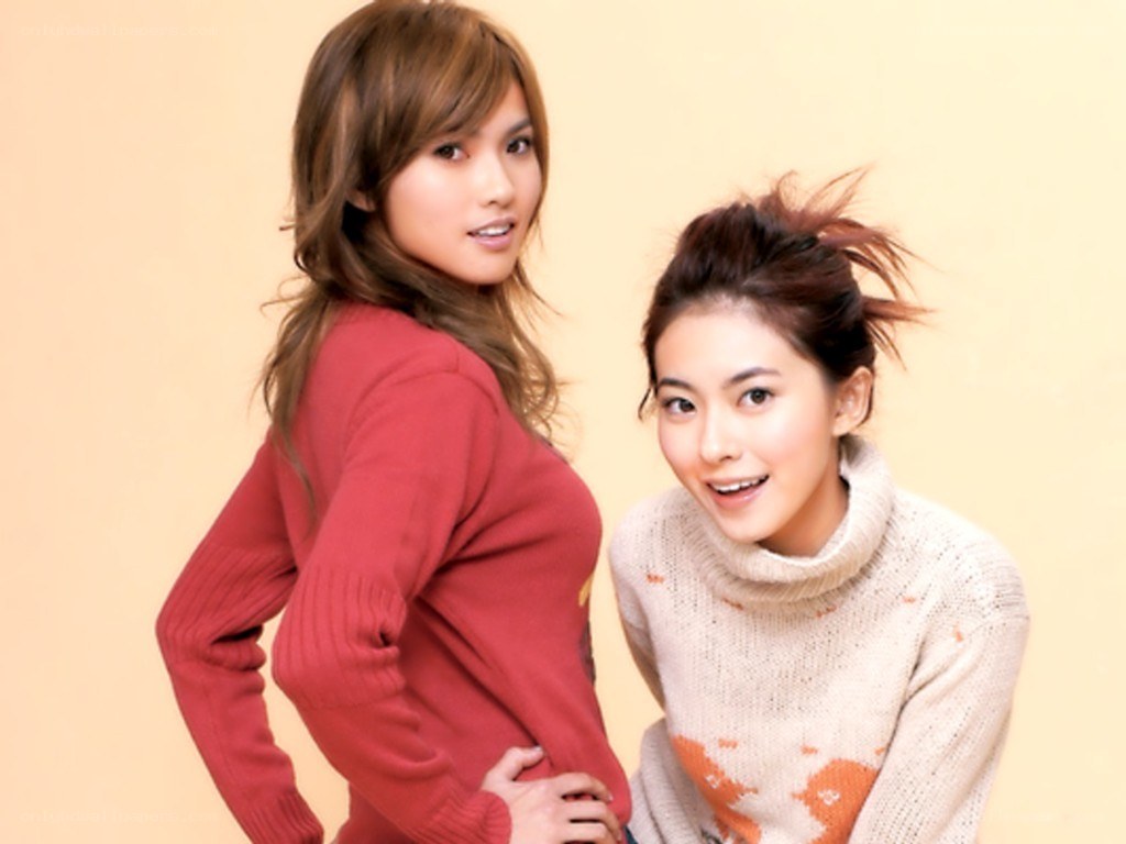 two women in sweaters