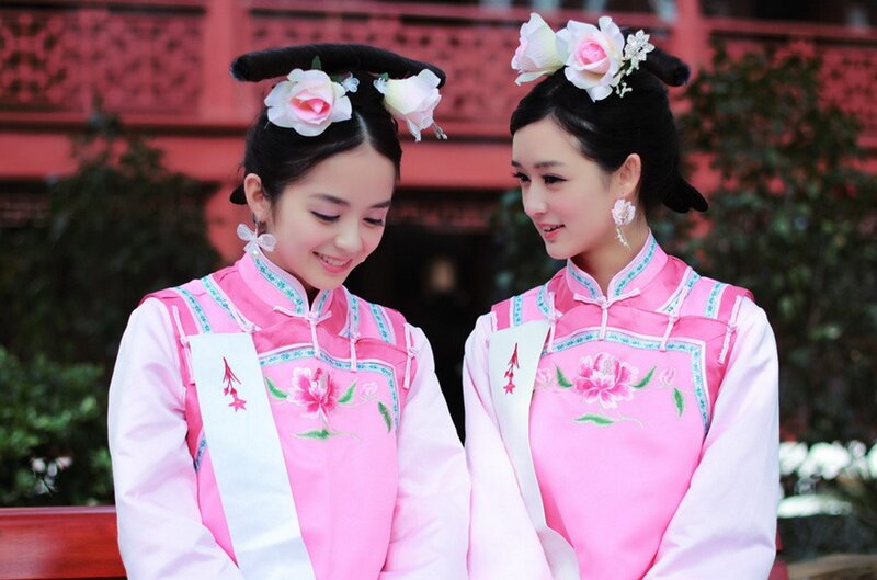 Two women in traditional pink attire