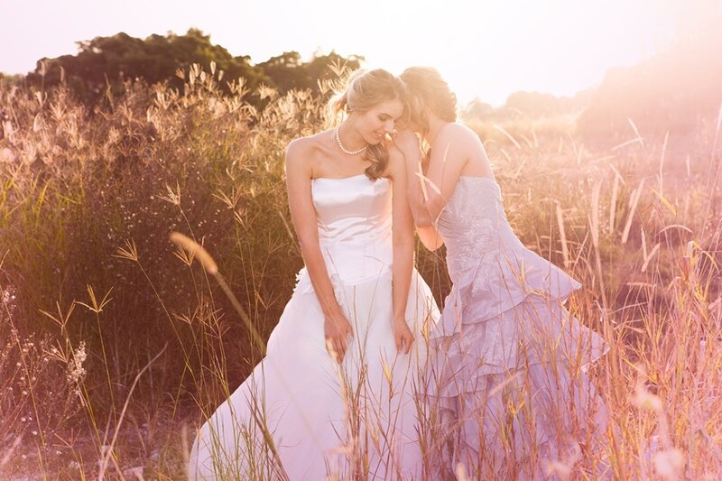 Two Women in Wedding Dresses — White, Serene, Sunset