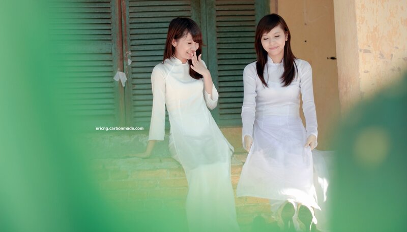 Two women in white ao dai