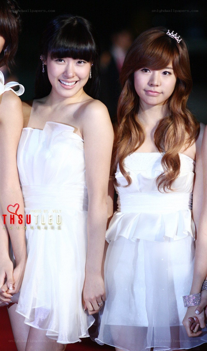 Two women in white dresses
