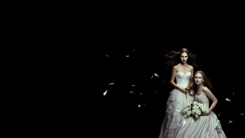 Two women in white dresses