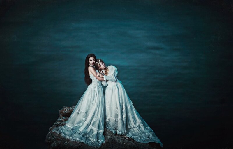Two Women in White Dresses — Dramatic, Night, Photograph