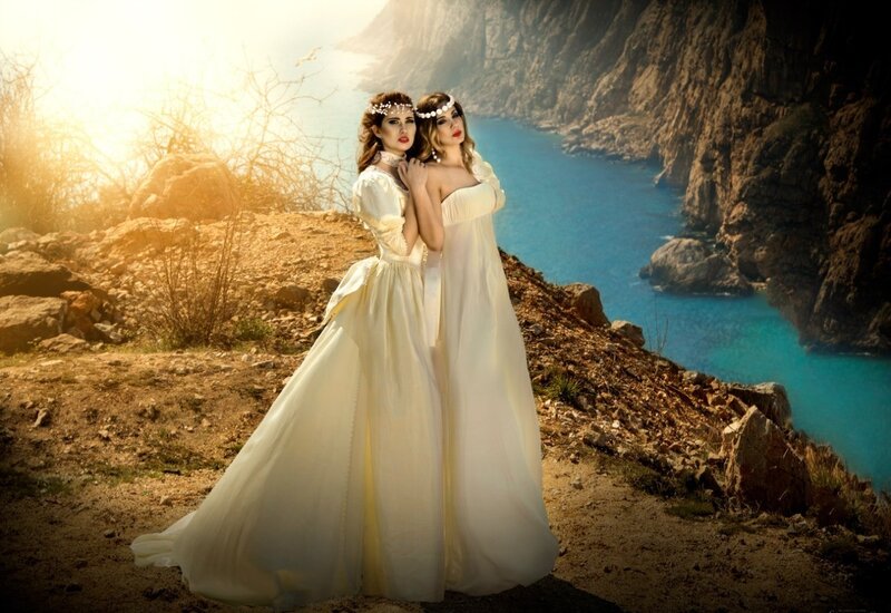 Two Women in White Dresses — Dramatic, Sunset