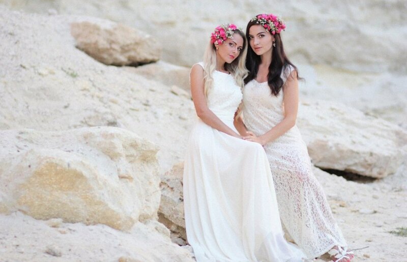 Two Women in White Dresses — Serene, Afternoon, Photograph, Flower Crowns, Rocks
