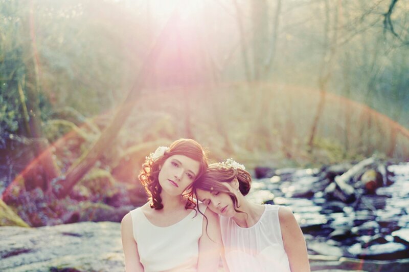 Two Women in White Dresses — Serene, Afternoon, Photograph, Flowers