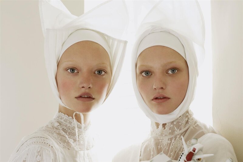 Two women in white head coverings