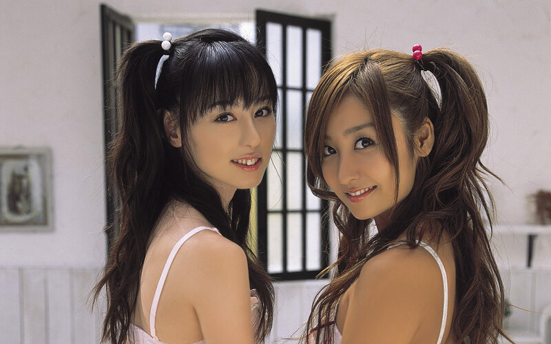 two women in white tops