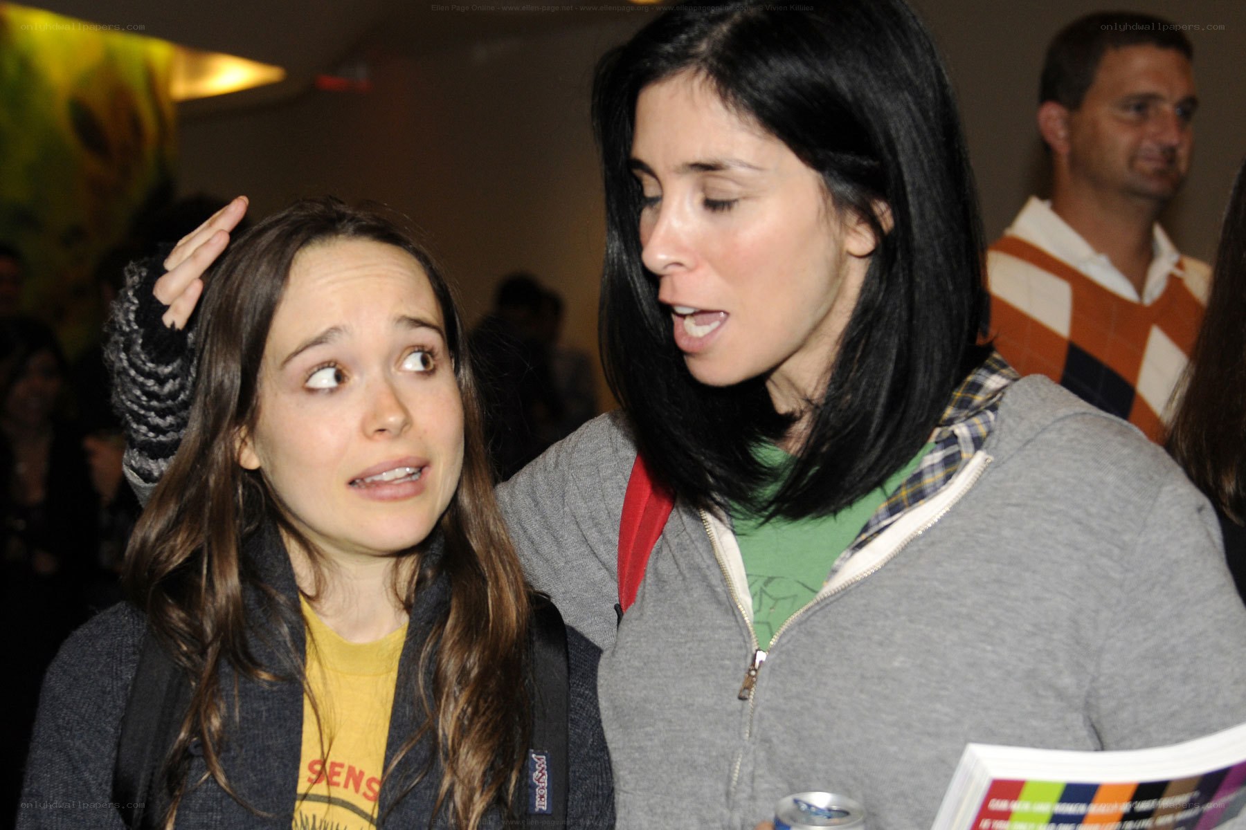 Two women interacting at event