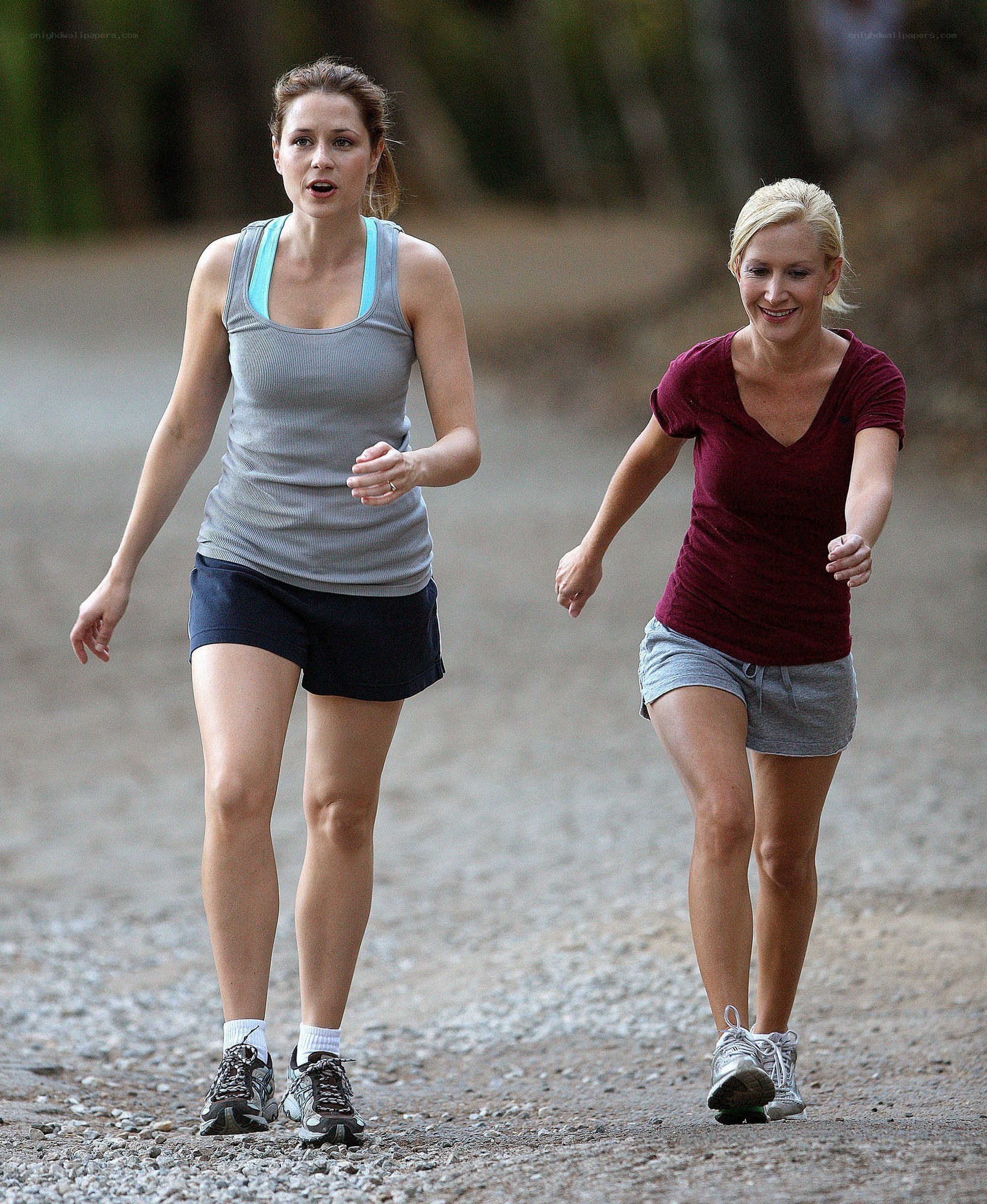Two women jogging on a path