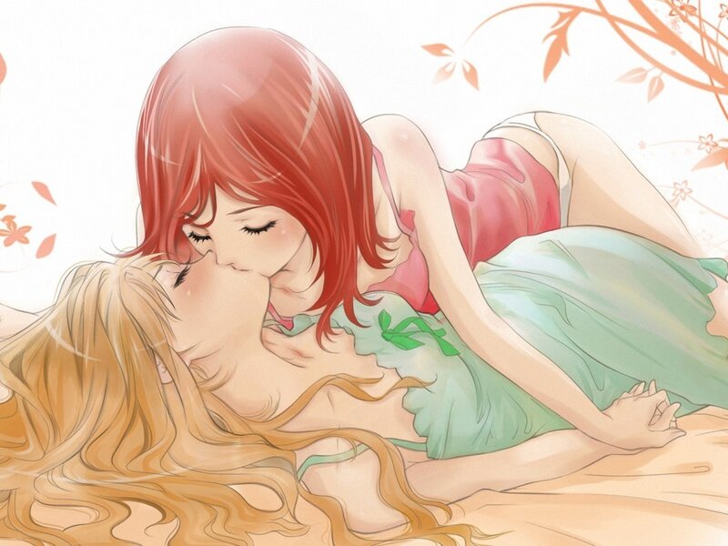 Two women kissing in a garden