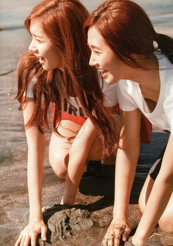 Two women laughing on the beach