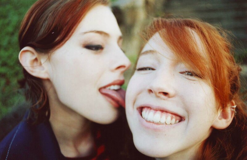 Two Women Laughing — Red, Playful