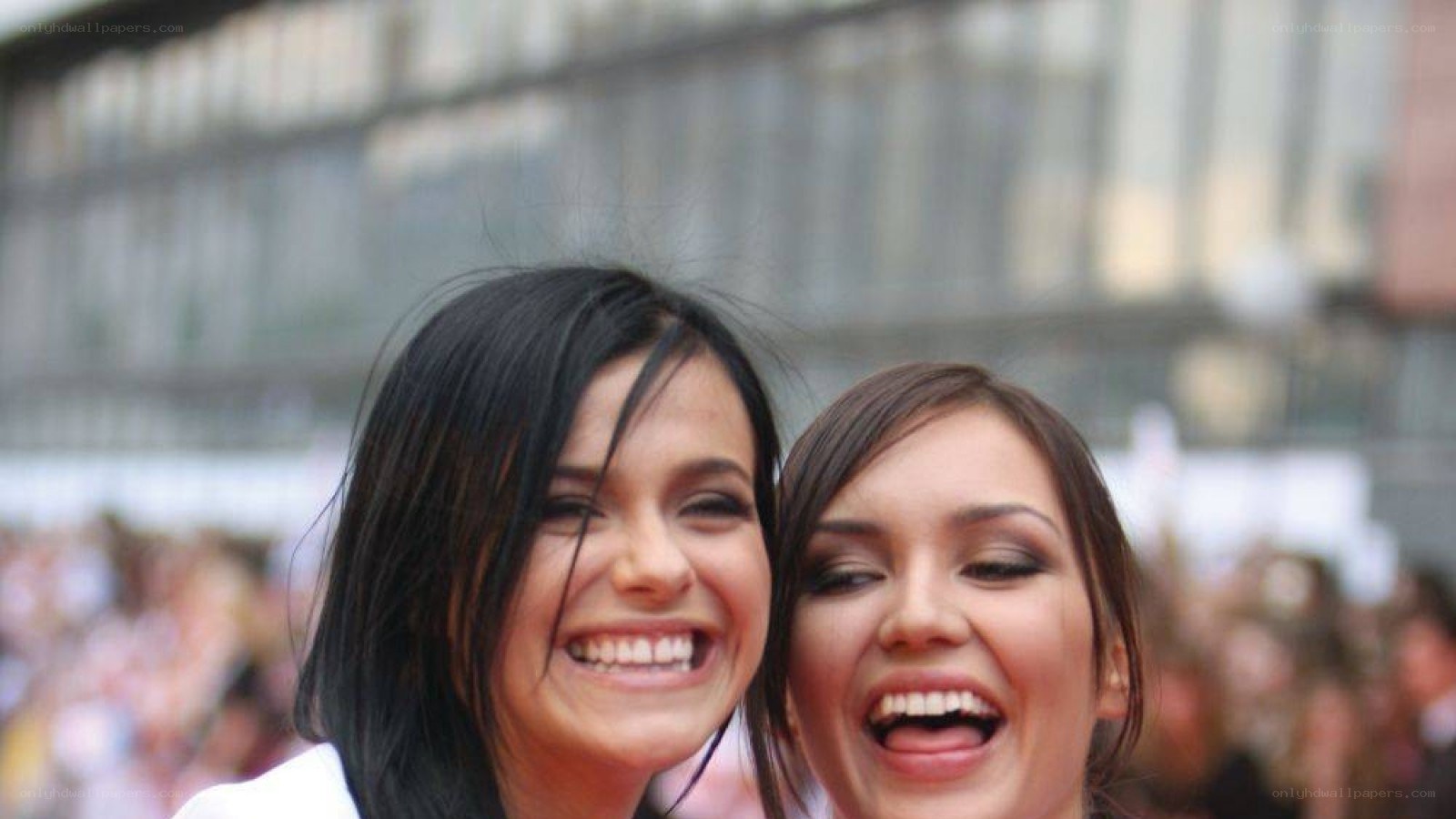 two women laughing together