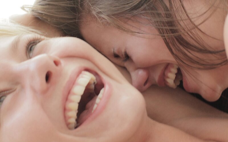 Two Women Laughing — White, Joyful