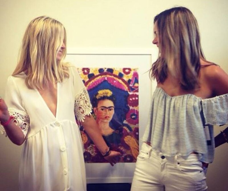 Two Women Looking at a Painting