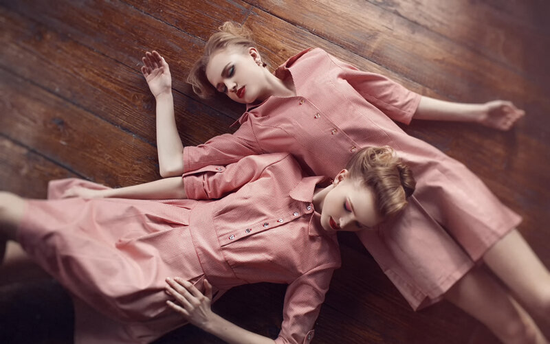 Two Women Lying on Floor