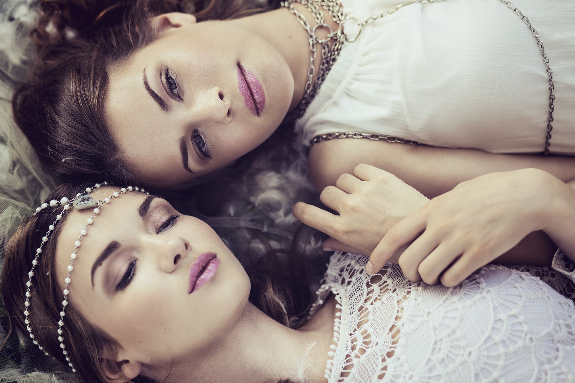 Two women lying together
