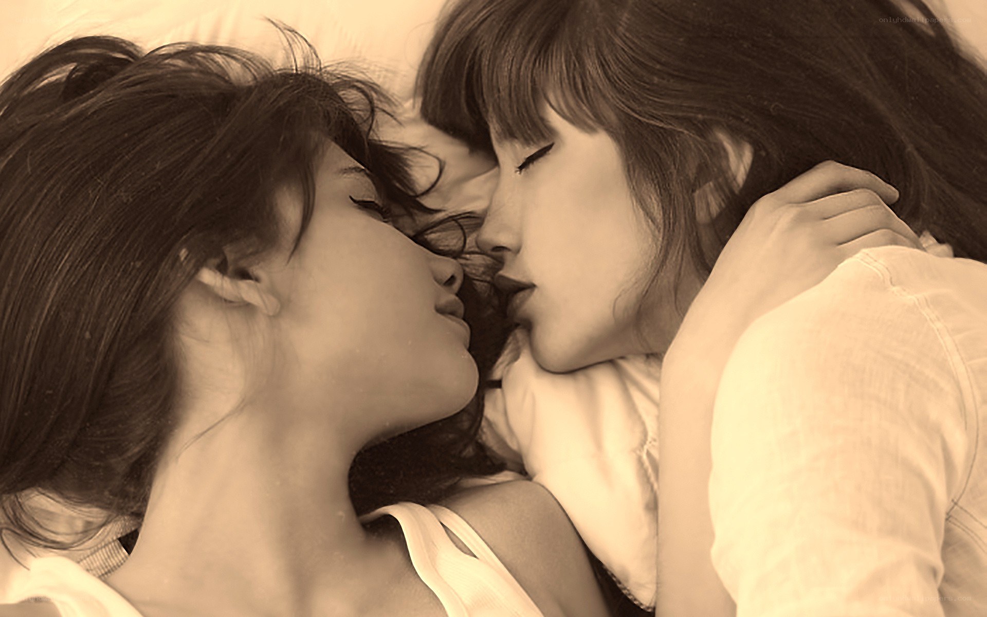 Two women lying together
