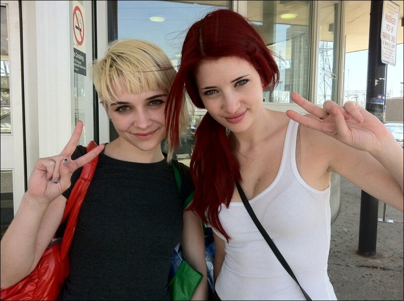 Two women making peace signs