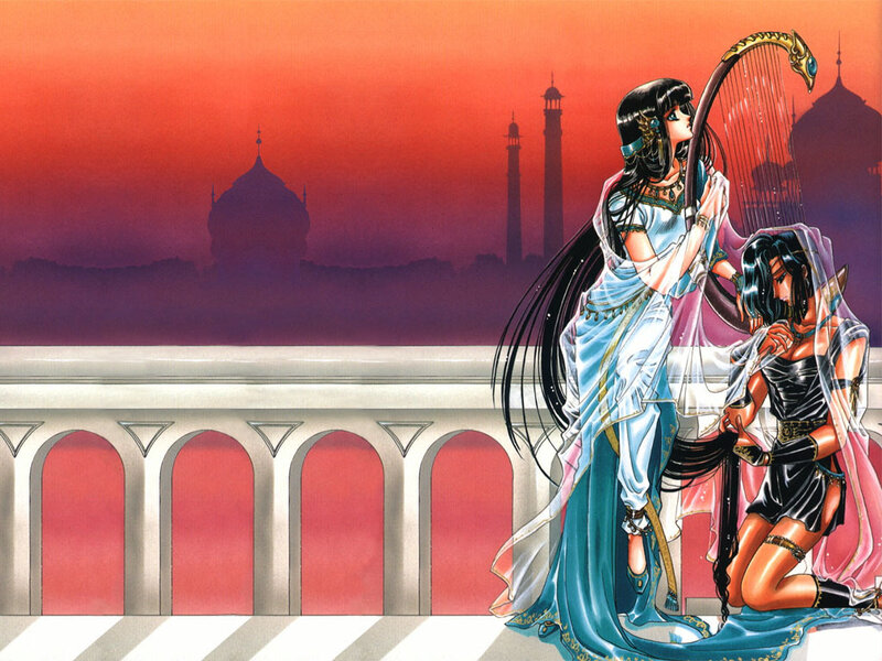 Two women on a balcony at sunset