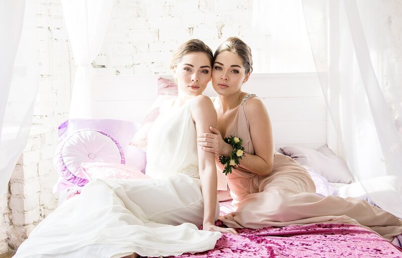 Two Women on a Bed — White, Serene, Morning