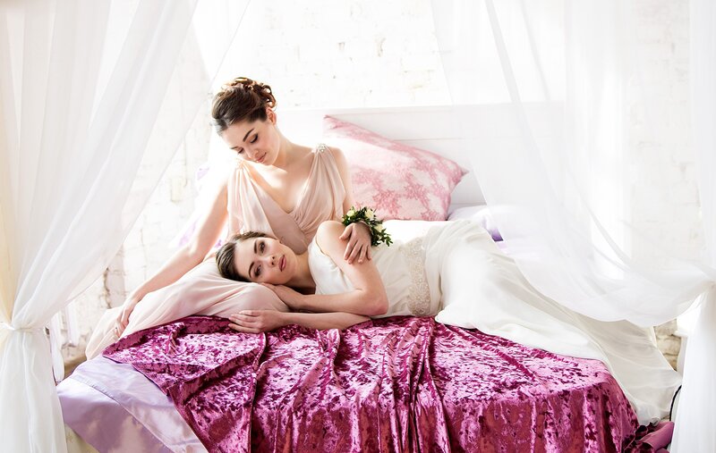 Two Women on a Bed — White, Serene
