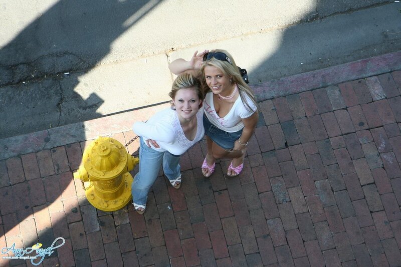 Two women on a brick sidewalk