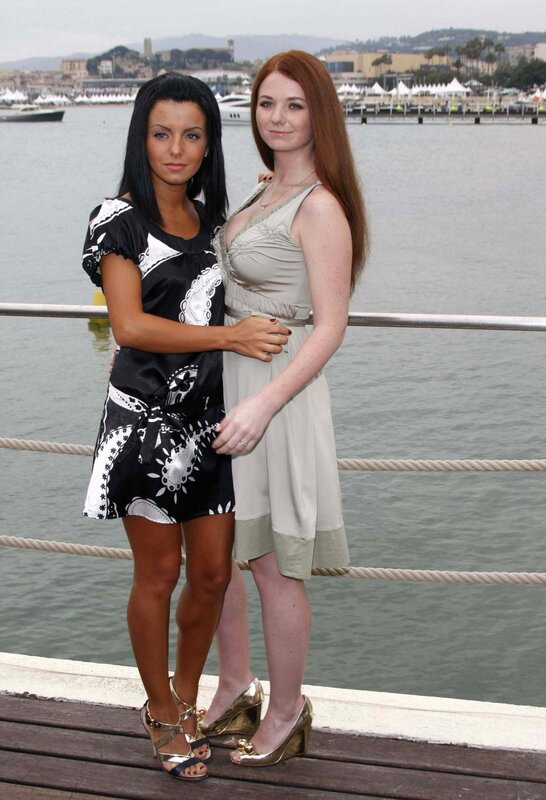 Two women on a dock by the water
