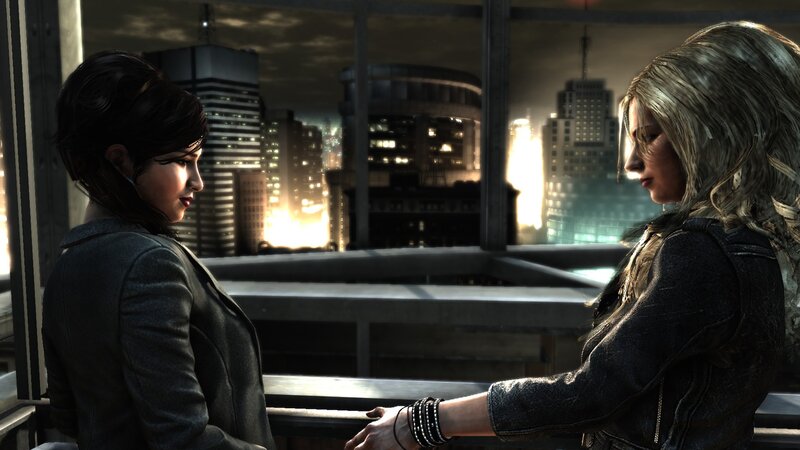 two women on a rooftop at night