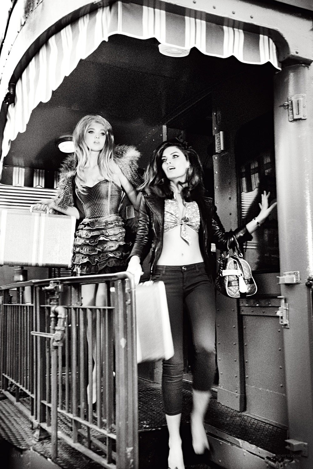 Two women on a train platform