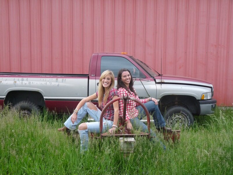 Two Women on Farm Equipment