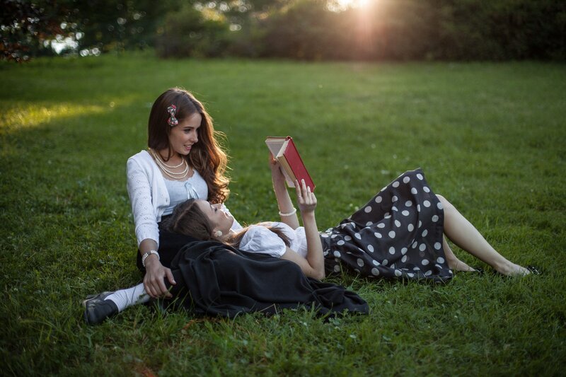 Two Women on Grass — Green, Serene, Sunset