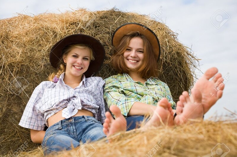 Two Women on Hay Bale