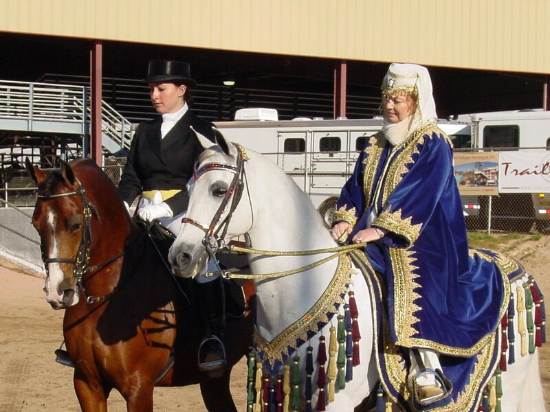 Two Women on Horses — Blue
