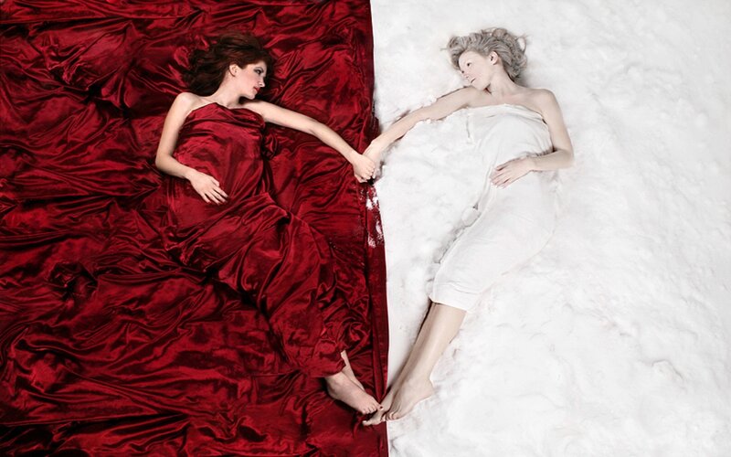 Two women on red and white surfaces