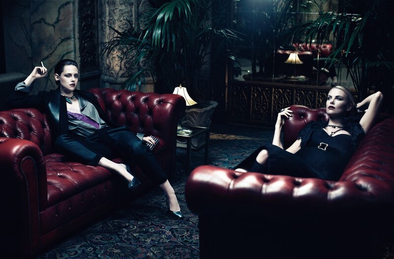 Two women on red couches