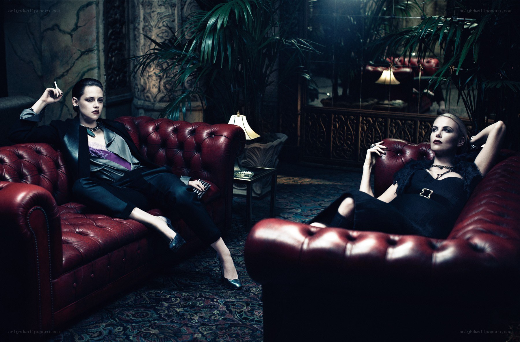 Two women on red couches