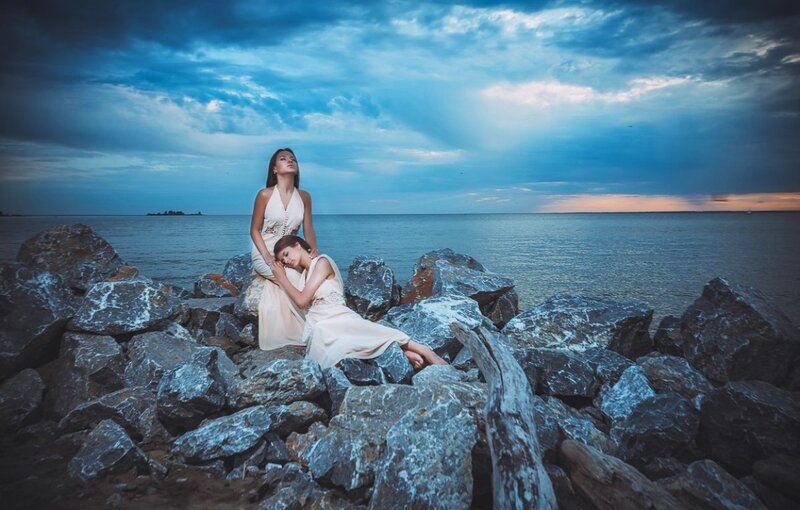 Two Women on Rocks — Blue, Dramatic, Sunset