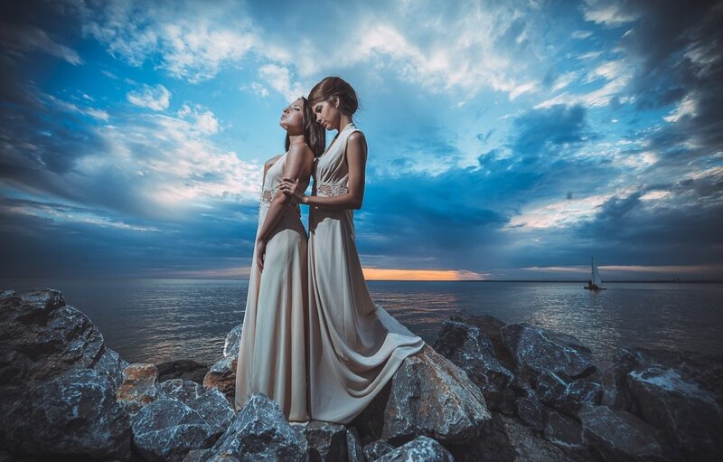 Two Women on Rocks — Blue, Dramatic