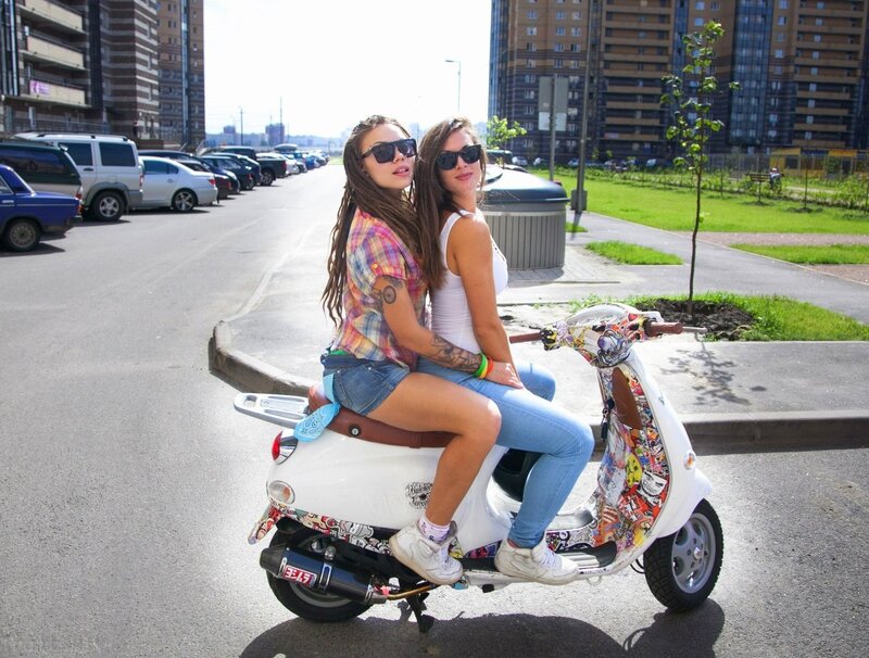 Two Women on Scooter — White