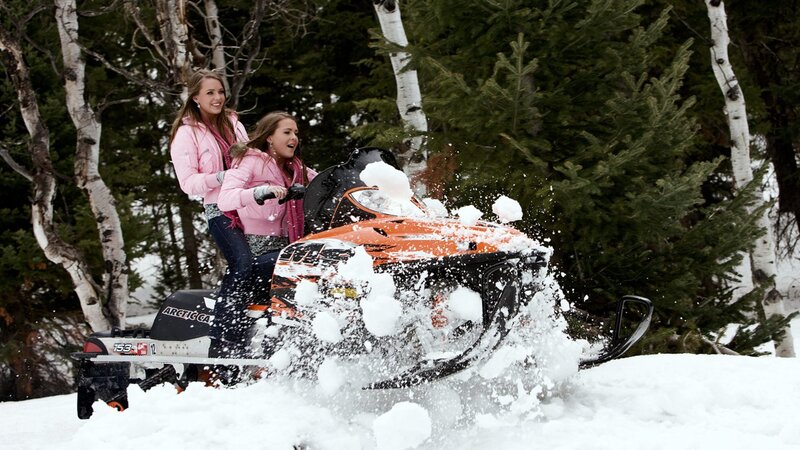 Two Women on Snowmobile