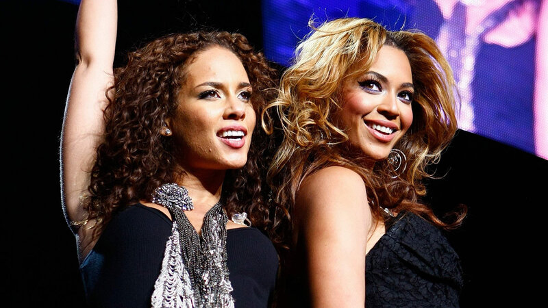 Two Women on Stage — Black, Energetic