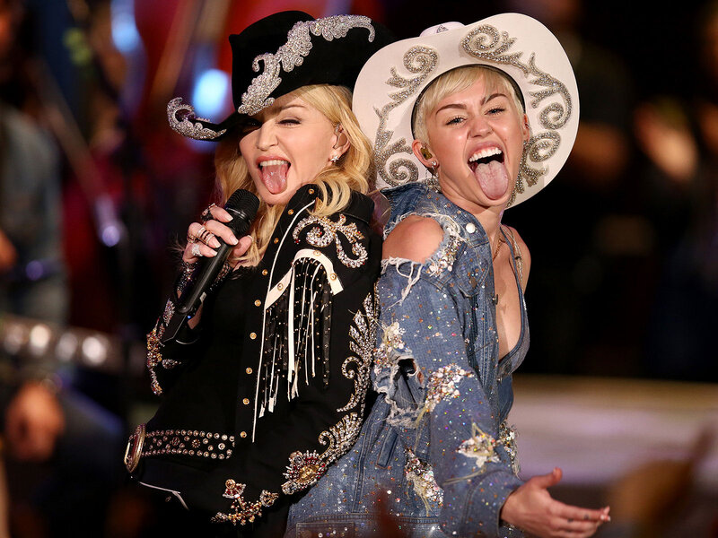 Two Women on Stage — Black, Playful