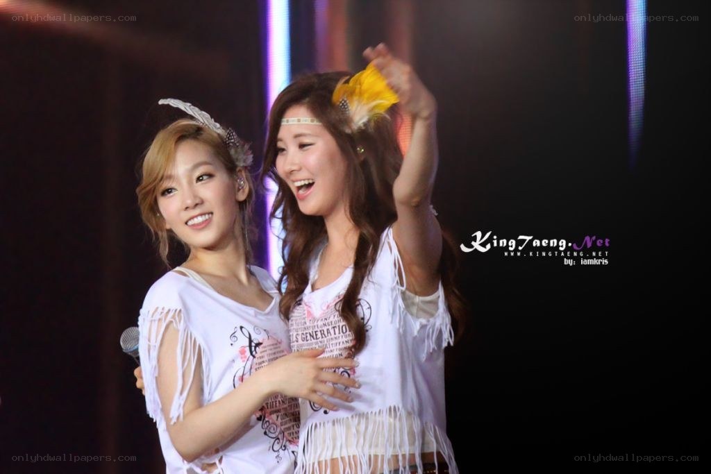 two women on stage smiling
