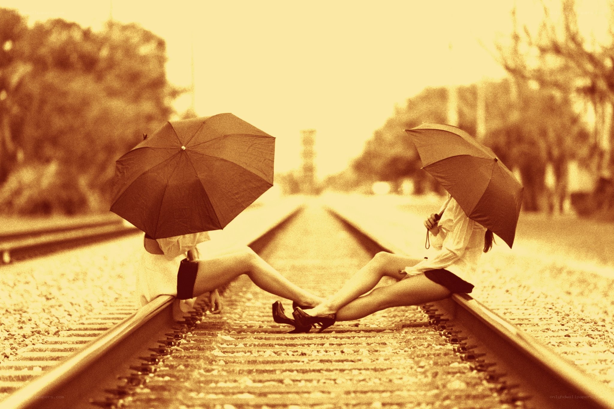 Two women on train tracks