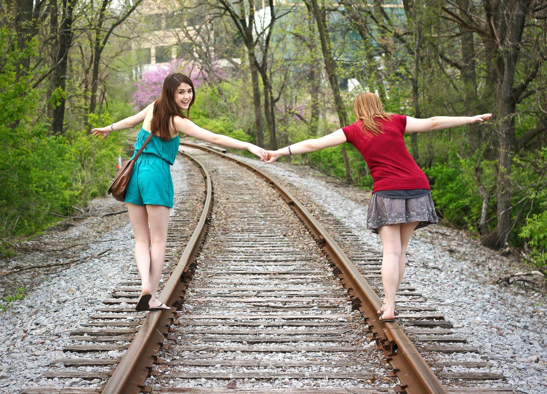 Two women on train tracks