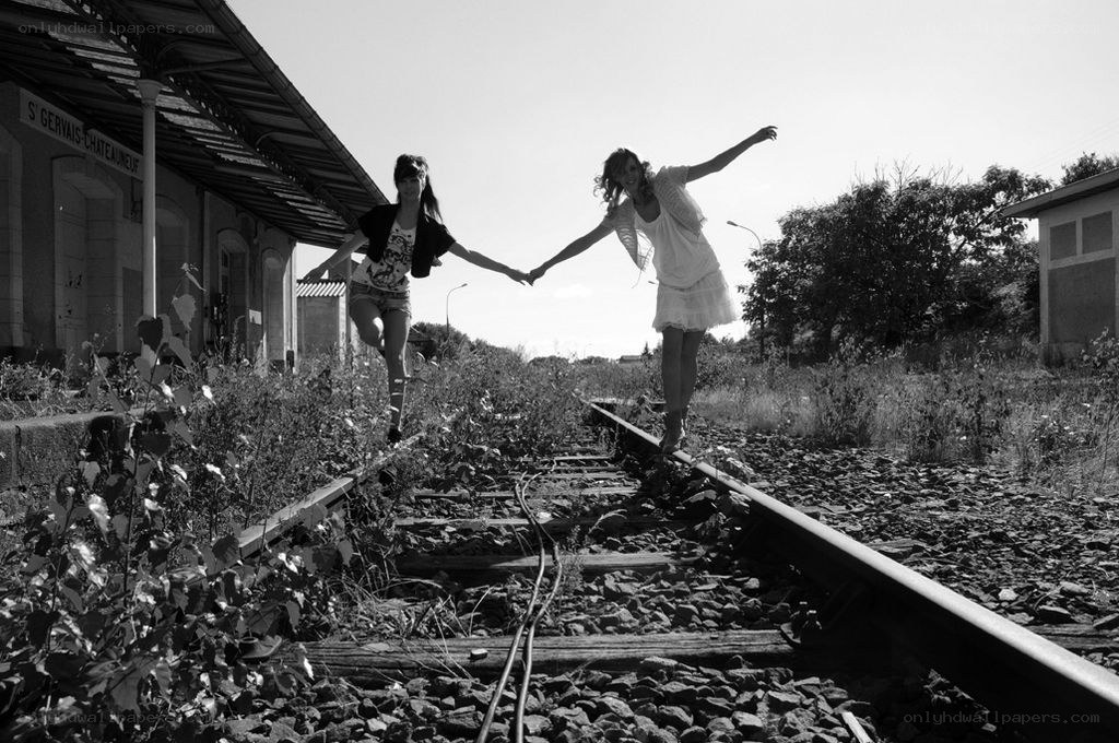 Two women on train tracks