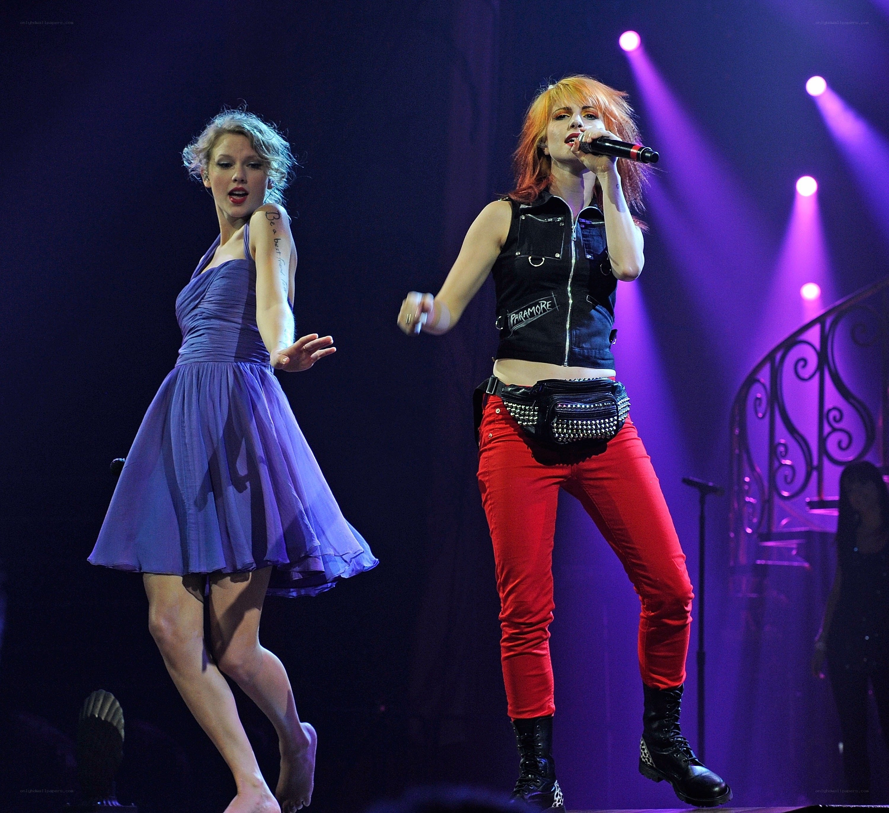 Two women performing on stage